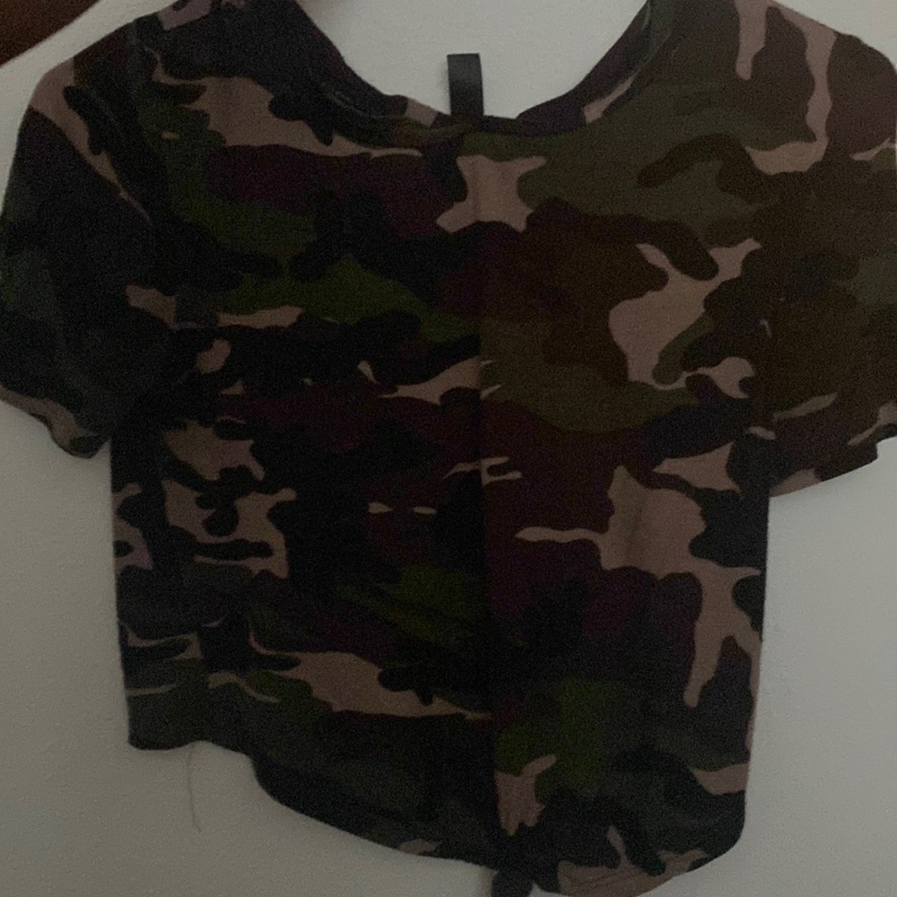 A camouflage crop top, great to go with black jeans and silver jewelry.